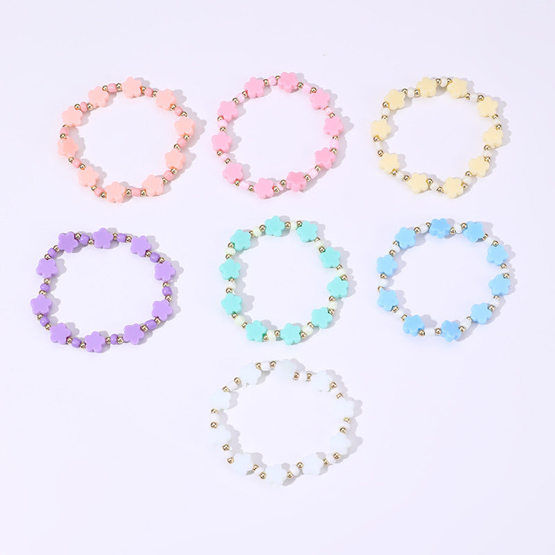 Braccialetto Minimalista a Stella con Perline per Bambini Realizzato in Plastica e Resina con Accenti Floreali Colorati