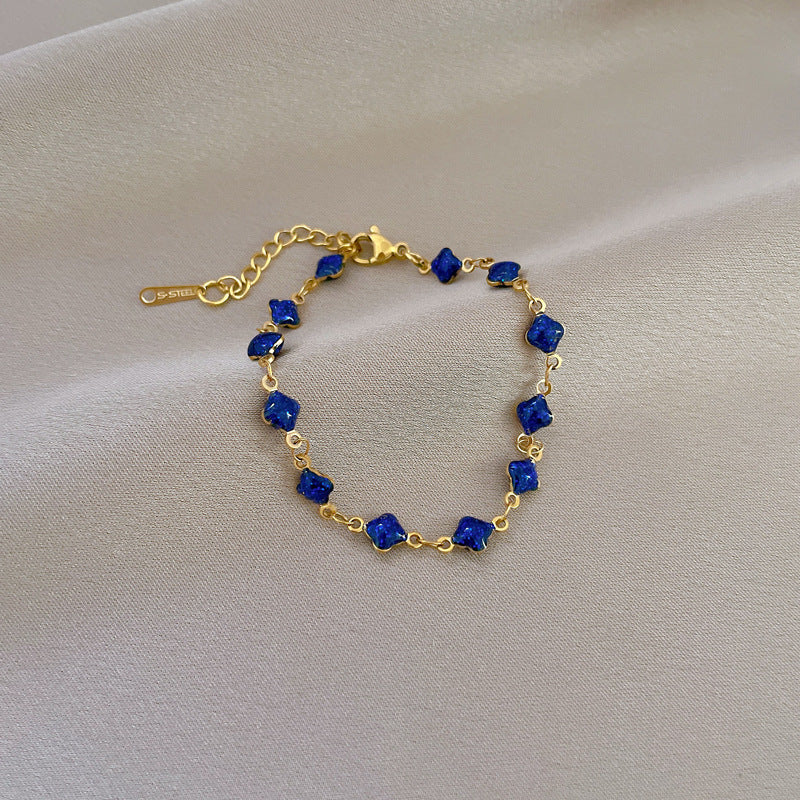 Minimalist Lucky Clover Blue Titanium Steel Bracelet for Women with Gold Plating and Wavy Texture