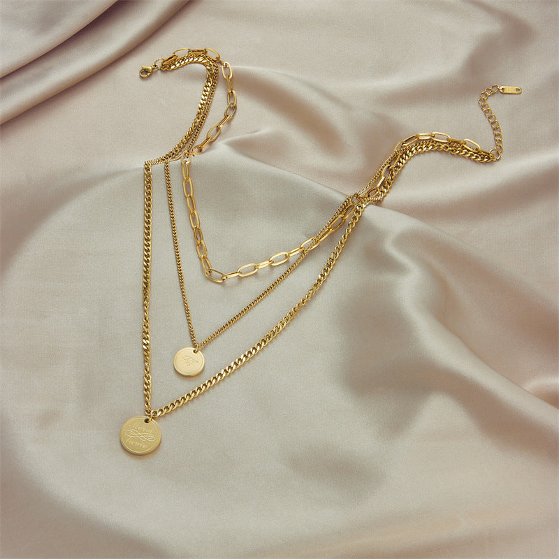 Collana da Donna Minimalista Vintage Multi-Strato in Acciaio al Titanio con Pendente Rotondo Inciso e Catena Snake