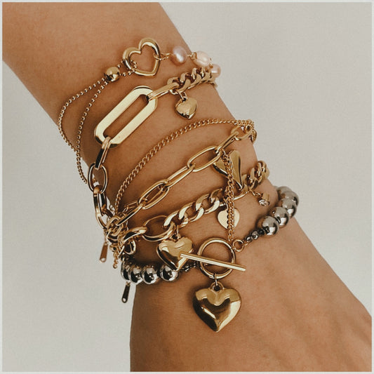 Pulsera minimalista de acero inoxidable con forma de corazón, detalles de perlas y broche OT para mujer
