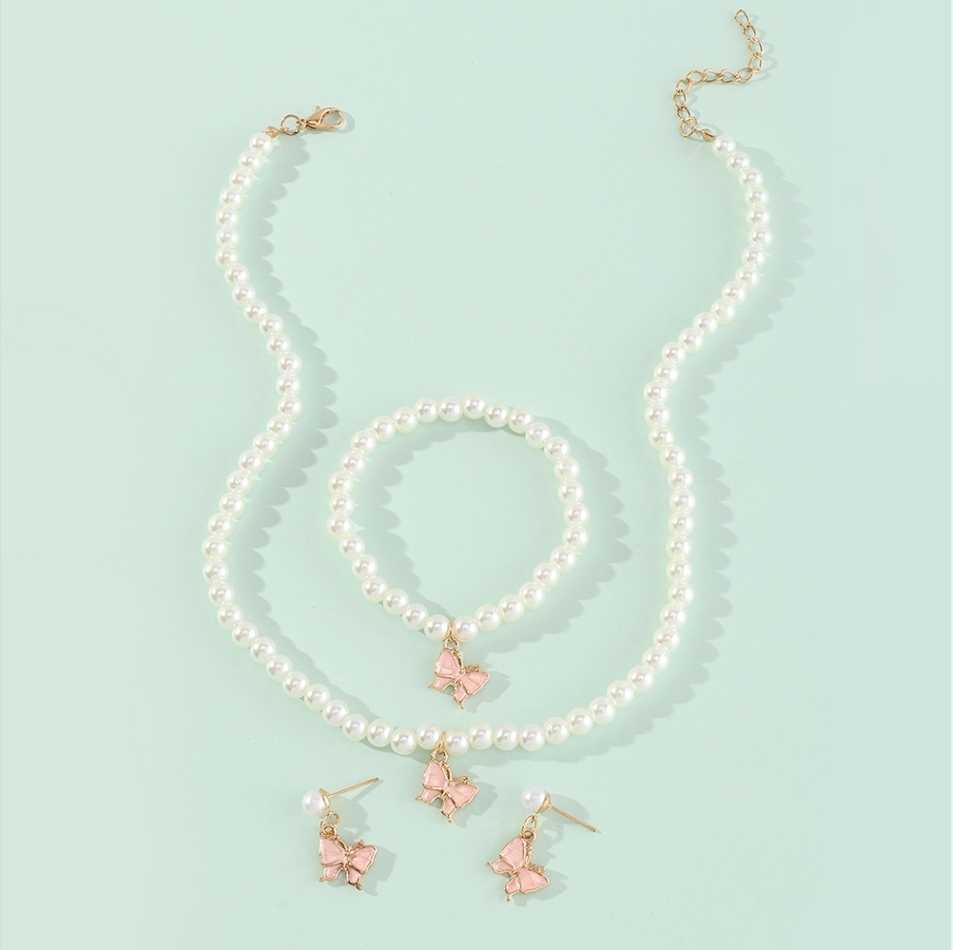 Conjunto Minimalista de Collar con Forma de Lazo de Aleación para Niñas con Detalles de Perlas, Incluye Pulsera, Anillo y Pendientes de Botón