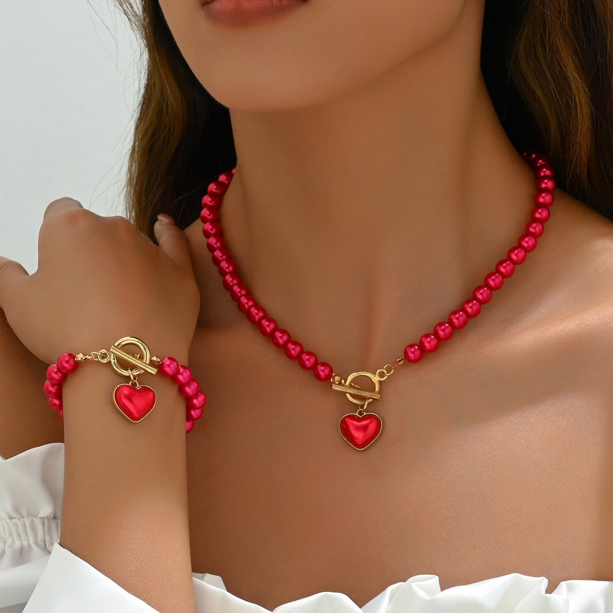 Juego de collar y pulsera minimalistas de aleación en forma de corazón con incrustaciones de perlas para mujer