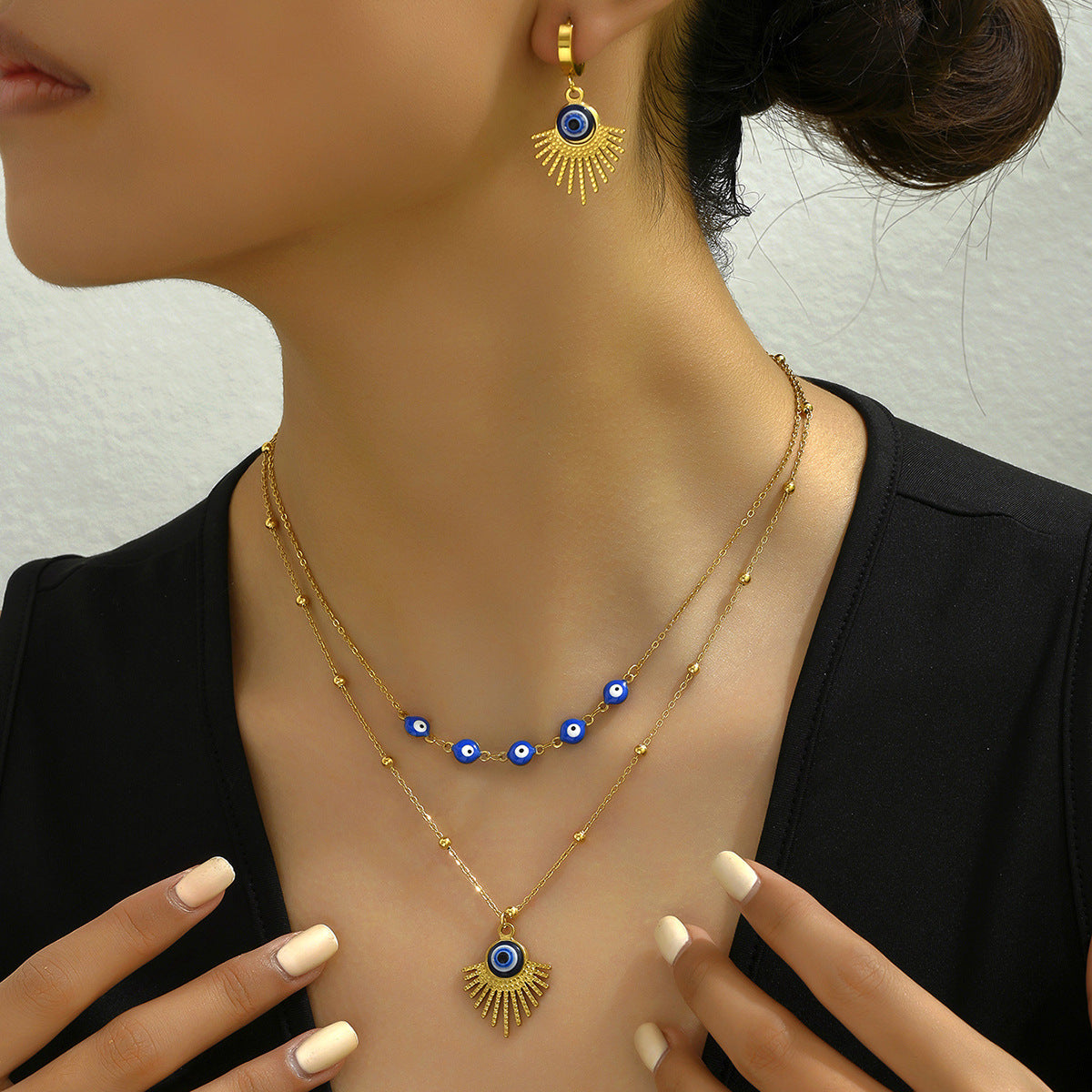 Collar y pendientes de ojo turco de estilo minimalista para viajeros en cobre con acabado esmaltado