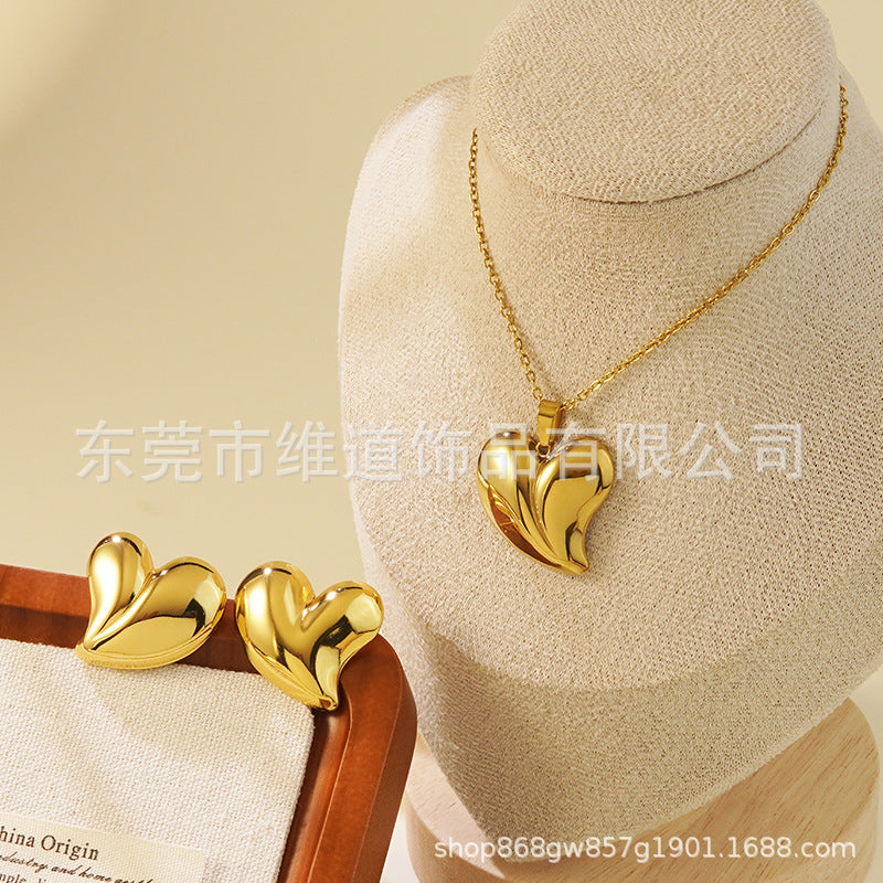 Conjunto de joyas de acero inoxidable con baño de oro minimalista con colgante de corazón floral y lazo en cadena para mujer