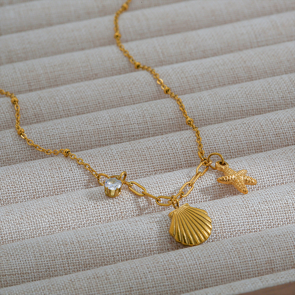 Collar con colgante de concha y estrella minimalista inspirado en el océano en acero inoxidable con baño de oro de 18 quilates en cadena O