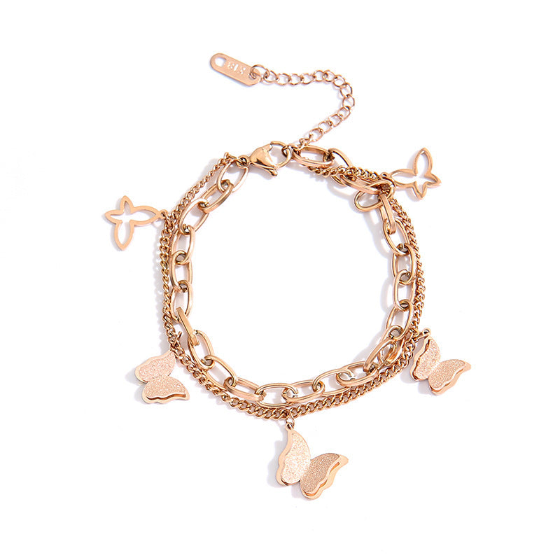 Bracciale a doppia farfalla in acciaio al titanio placcato oro rosa da donna con design geometrico e stile minimalista alla moda