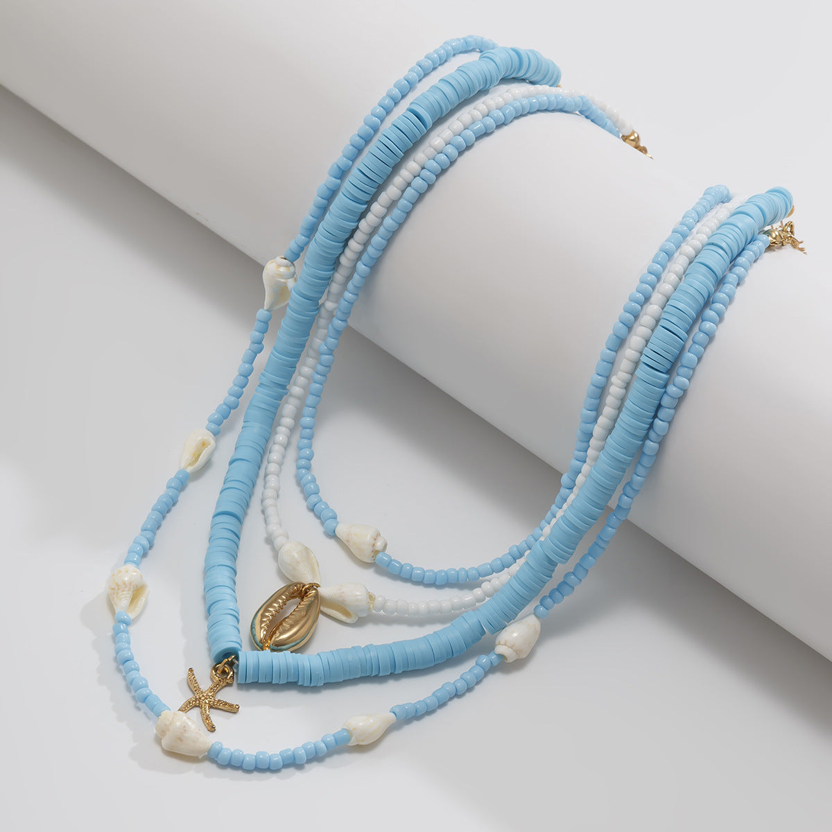 Collana bohémien vintage a strati con ciondolo a stella in conchiglia, lega galvanizzata, catena con perline