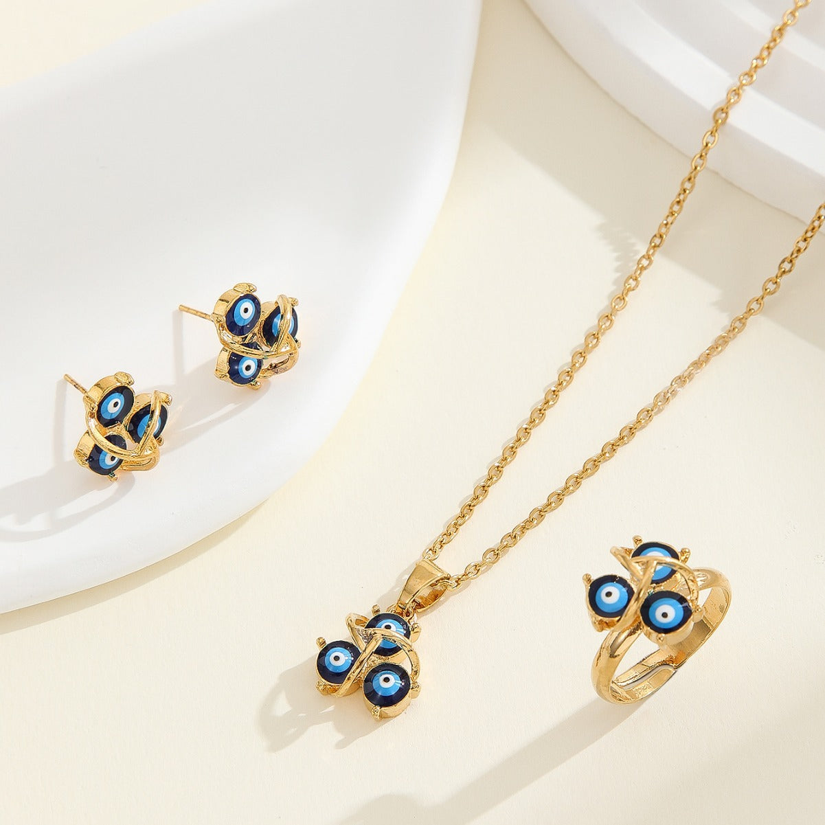 Conjunto de collar y pendientes de aleación, estilo americano minimalista y de moda, con diseño de ojo turco y acabado galvanizado, para mujer