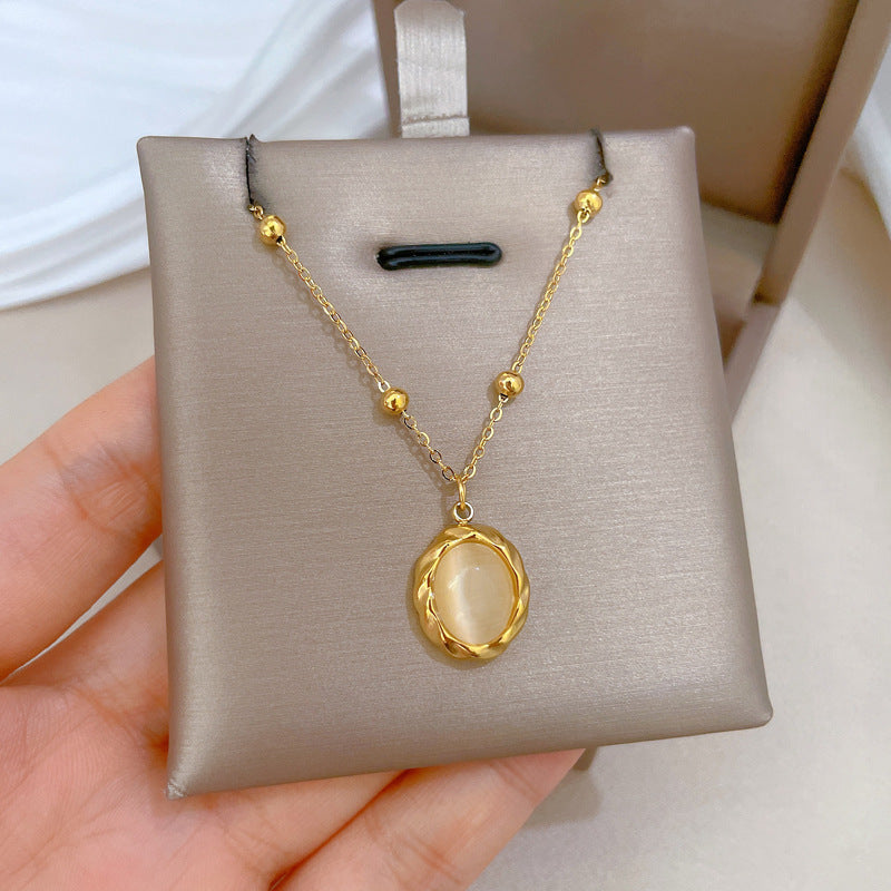 Collana girocollo da donna con ciondolo in pietra occhio di gatto girevole in acciaio inossidabile placcato oro dal design geometrico minimalista