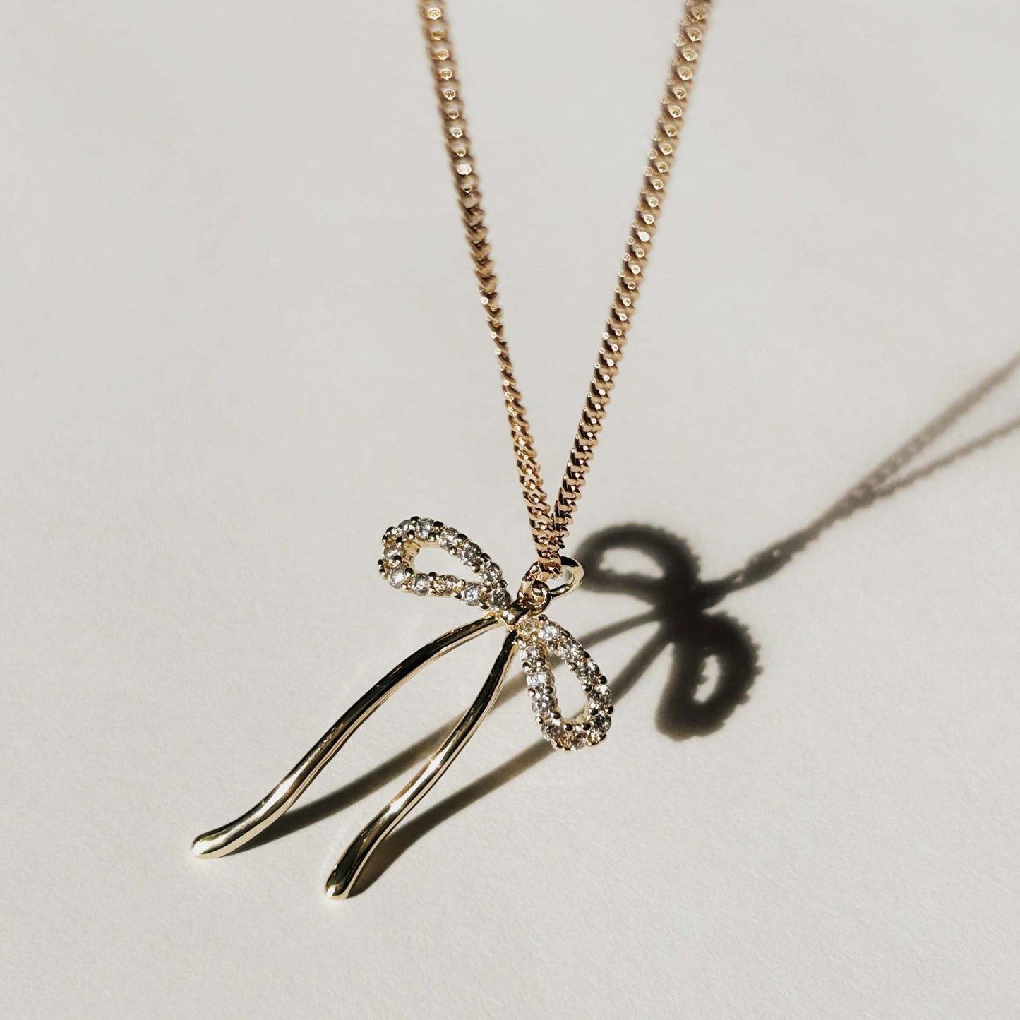 Minimalist Bow-Shaped Pendant Necklace for Women and Men with Titanium Steel Bow Charm on Snake Chain Stainless Steel Vacuum Plated Finish
