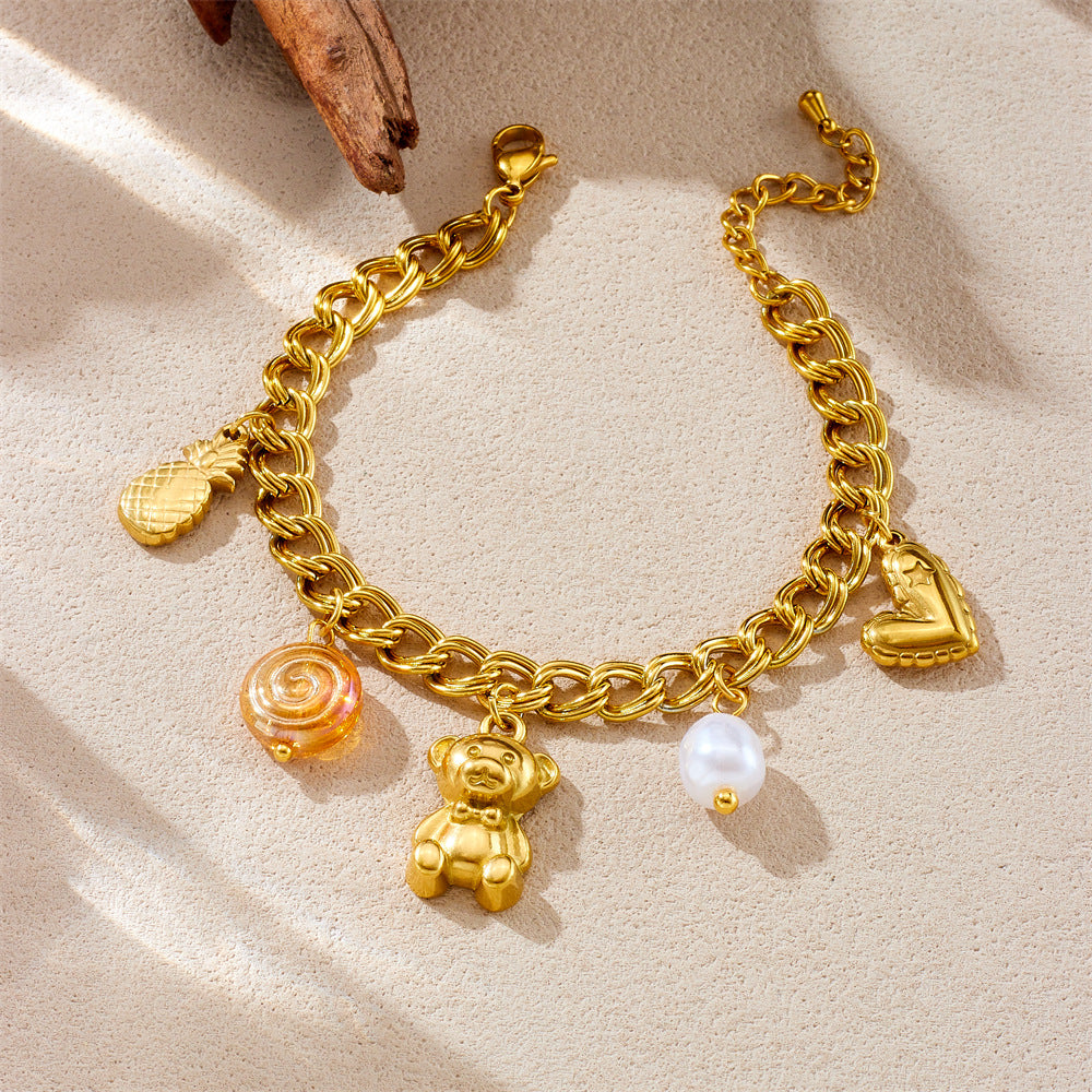 Elegante pulsera de acero inoxidable chapada en oro con doble círculo, colgante de corazón, piña u oso y detalles de perlas