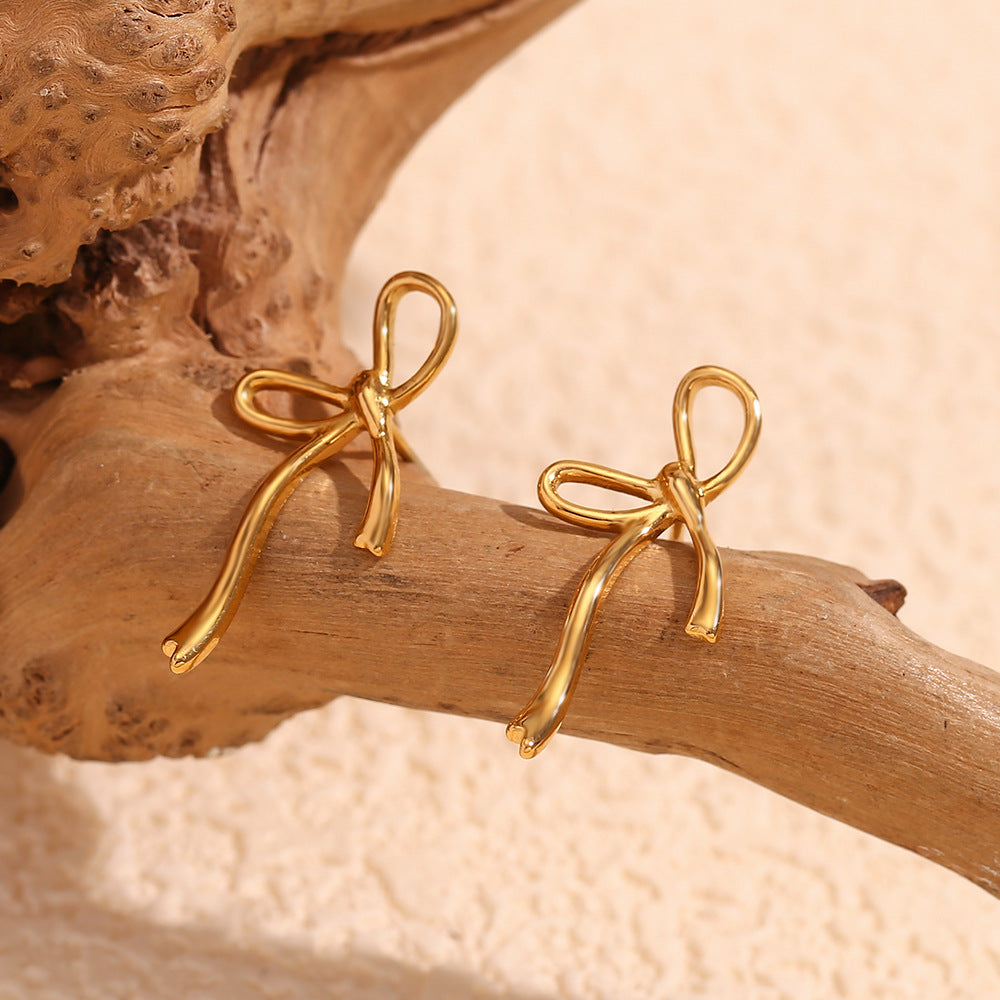 Pendientes minimalistas creativos de acero inoxidable con forma de lazo y baño de oro de 18 quilates para mujer