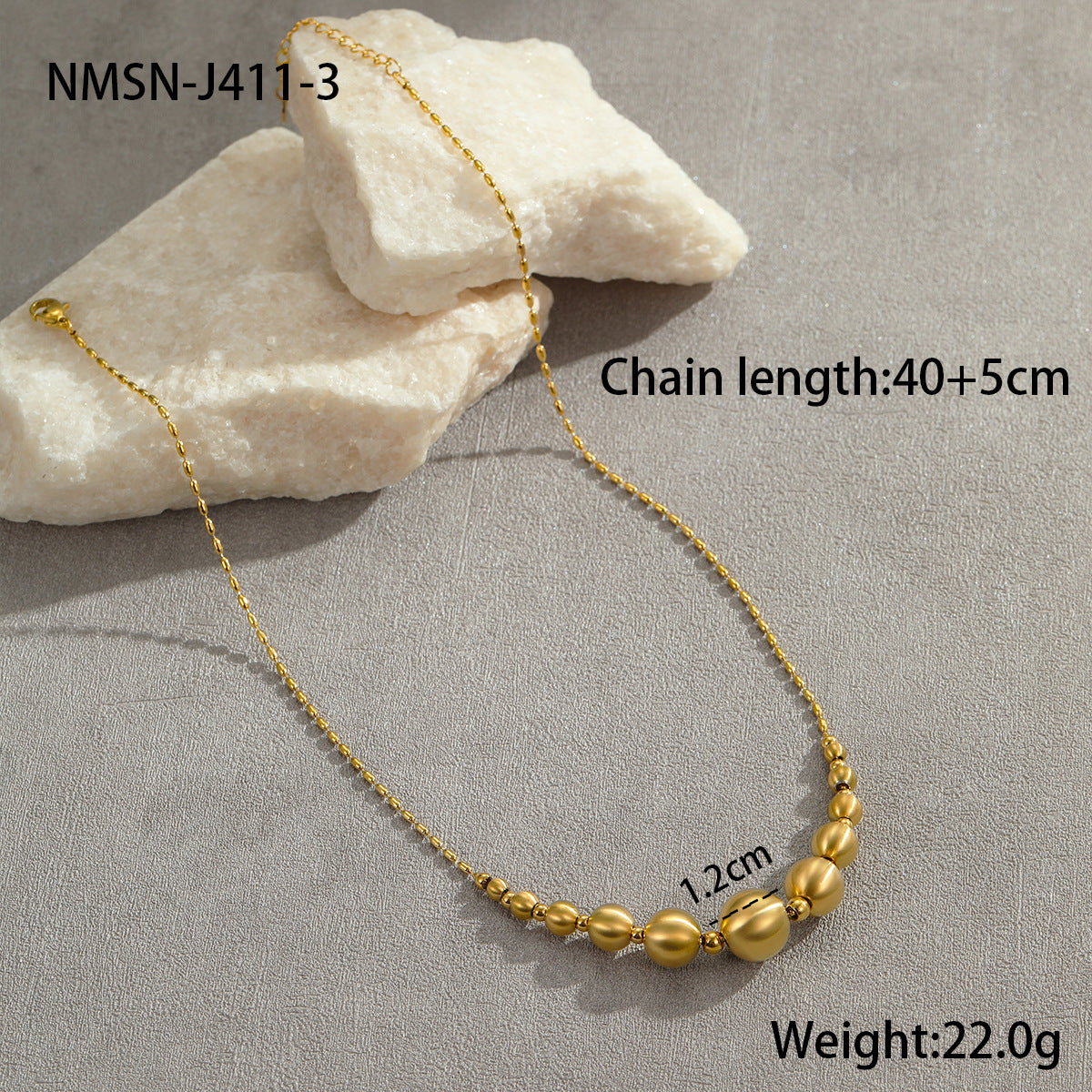 Collana da donna alla moda con perline a occhio di gatto in acciaio al titanio spazzolato con pendente geometrico placcato in oro 18 carati e delicata catena clavicolare