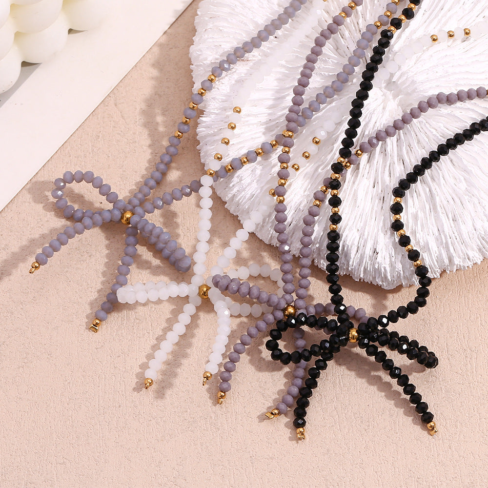 Collana con ciondolo minimalista a forma di fiocco in acciaio inossidabile con strass da donna