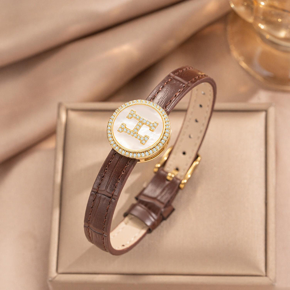Pulsera de puño redonda chapada en oro de acero inoxidable minimalista con correa de cuero genuino para hombres y mujeres