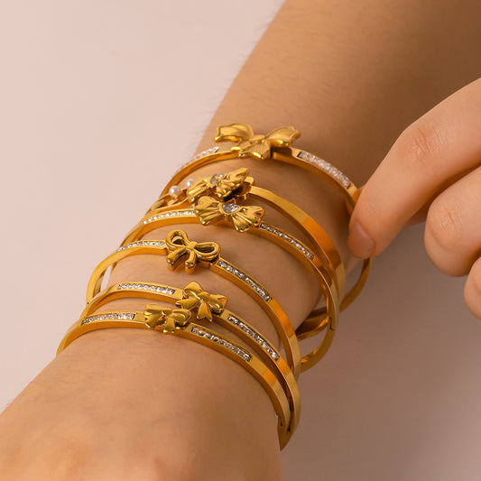 Asymmetrical Bow-Shaped Stainless Steel Bracelet for Women with Zircon Inlay and 18K Gold Plating
