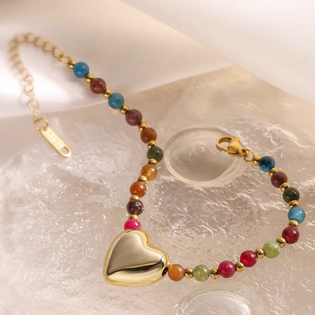 Bracciale da donna in acciaio inossidabile a forma di cuore con perline e finitura placcata, con dettagli in cristallo irregolare