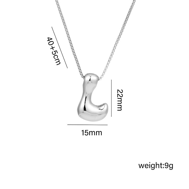 Collar con colgante de acero titanio con forma de letra minimalista y chapado en oro para mujer