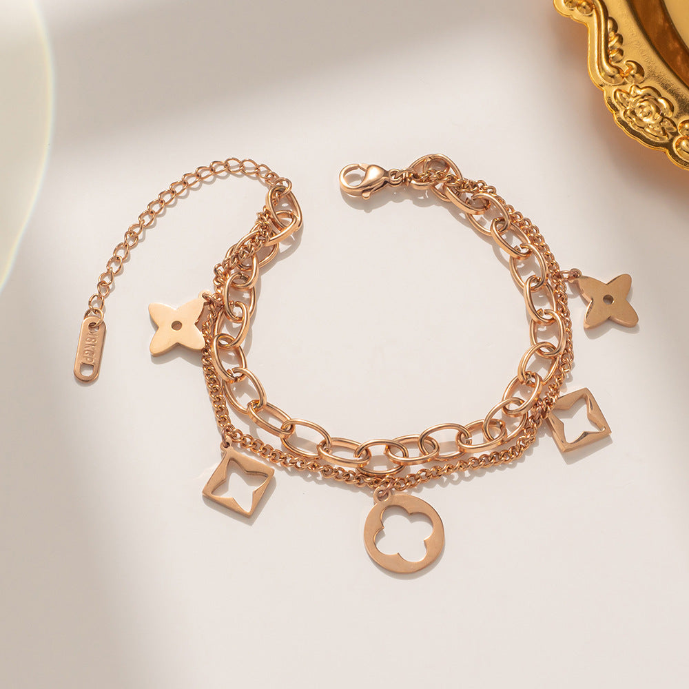 Bracciale da donna in acciaio inossidabile a forma di trifoglio, placcato in oro rosa 18 carati e con design traforato