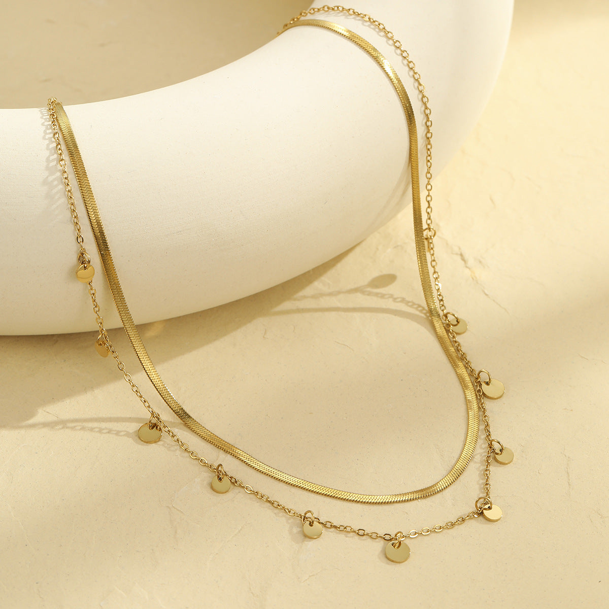 Collana da donna in acciaio inossidabile placcato oro 18 carati con nappe geometriche e vuote