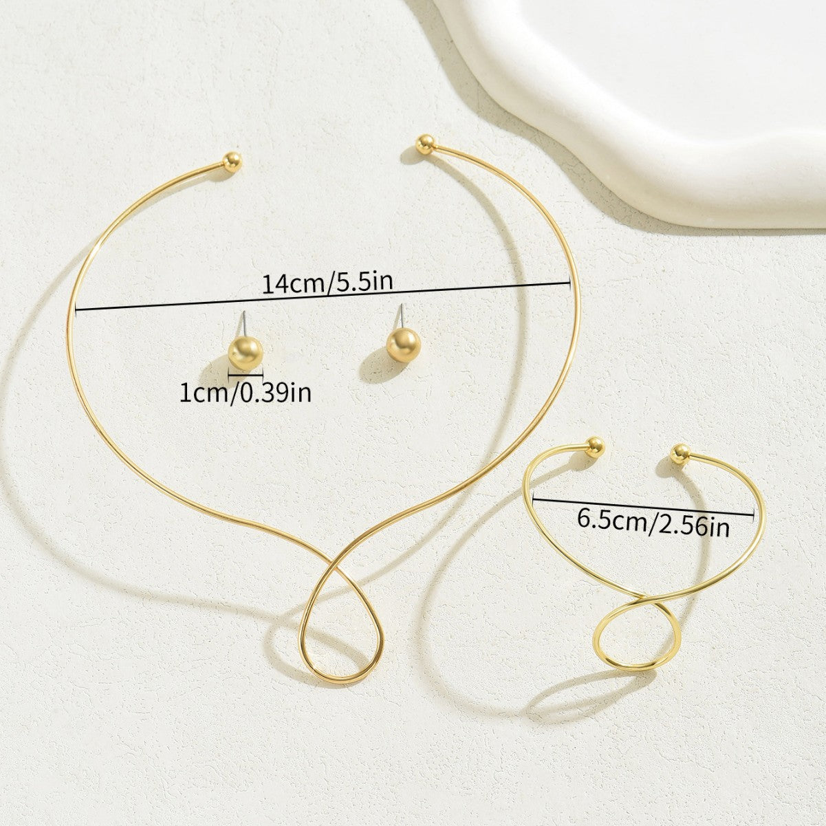 Set minimalist di collana, orecchini e bracciale geometrici in lega con finitura placcata da donna