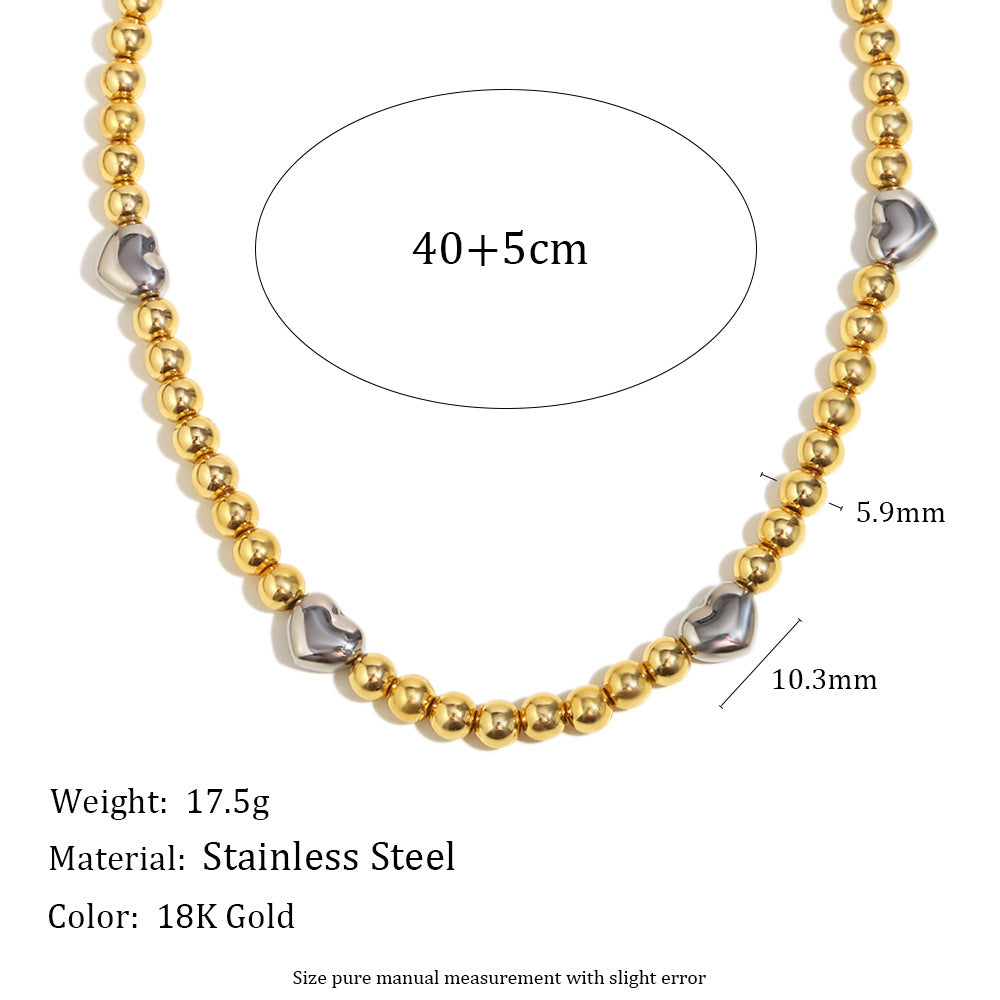 Collar de acero inoxidable minimalista con forma de corazón, chapado en oro de 18 quilates y detalle de cuentas.