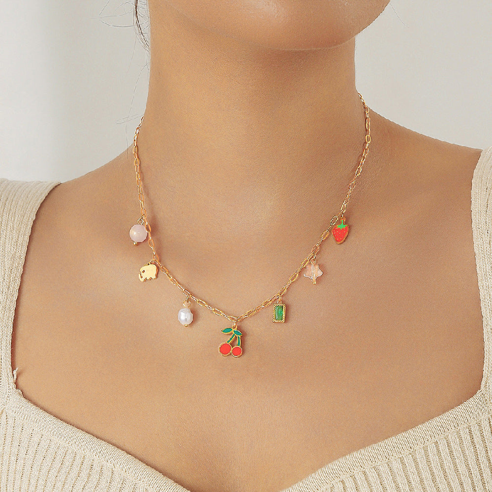 Sweet Drip Oil Stainless Steel Fruit Pendant Necklace with Pearl Cherry and Strawberry Elements for Women