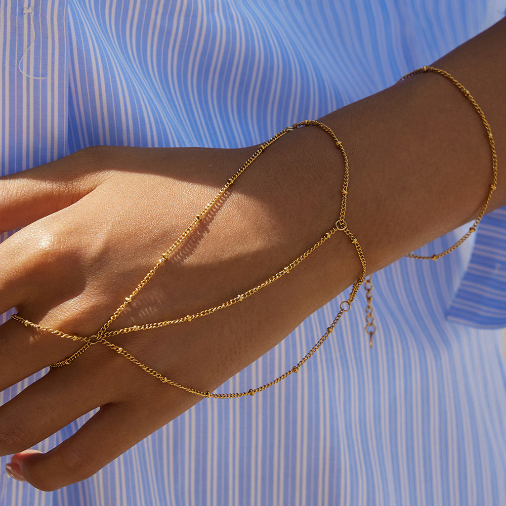 Pulsera de dedo de doble capa con borla geométrica de acero inoxidable y abalorios con acabado chapado para mujer
