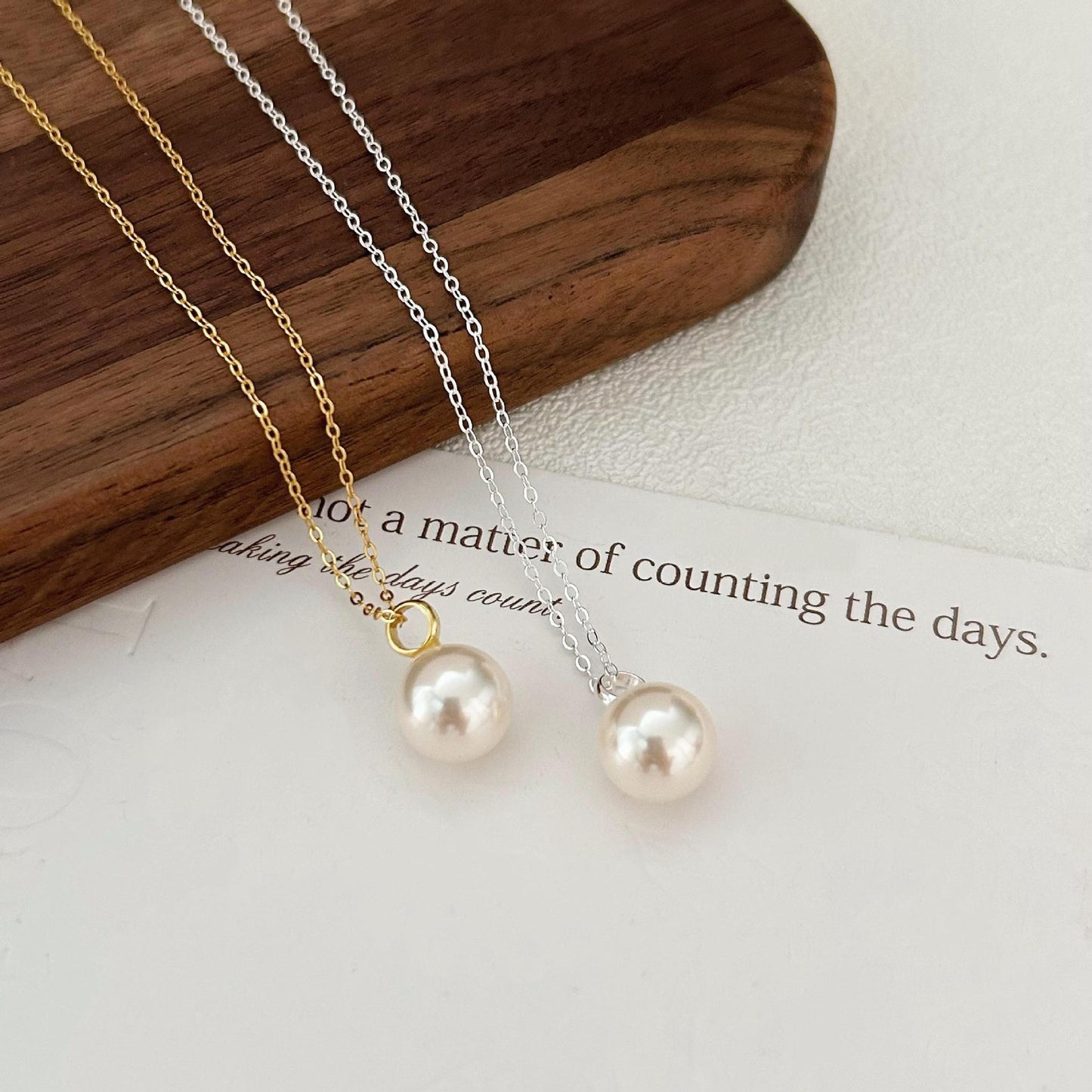 Minimalist Geometric Pearl Necklace in 925 Sterling Silver with Gold Plating on Cross Chain