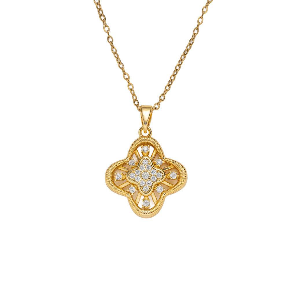 Collana con ciondolo a quadrifoglio geometrico vuoto di lusso in acciaio inossidabile con intarsio in zircone e placcatura in oro 18 carati da donna