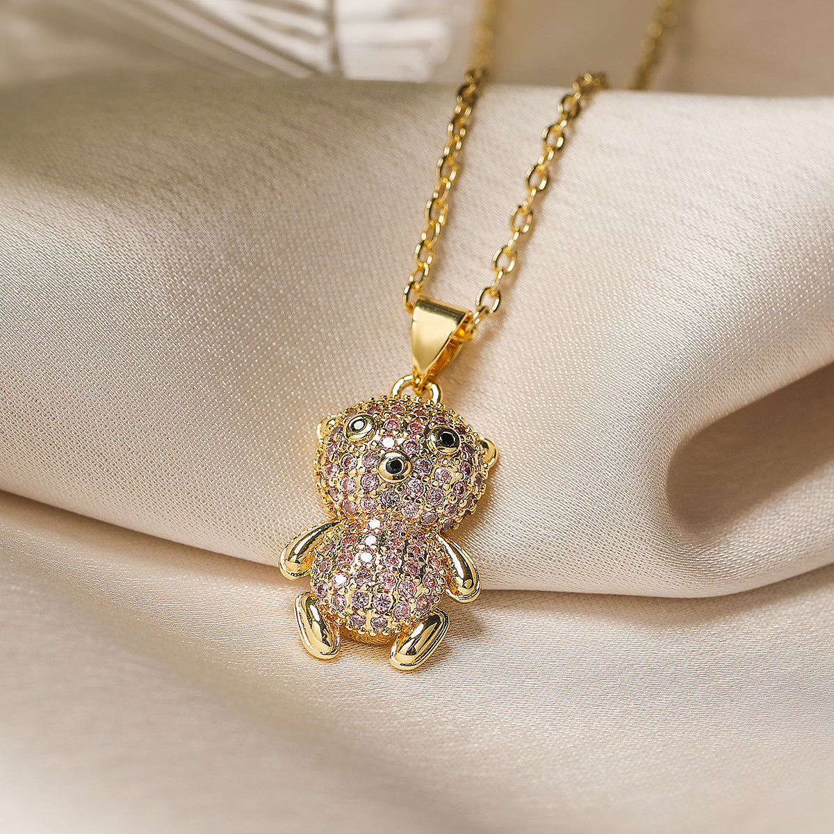Collana minimalista a forma di orso in rame placcato oro con accenti di zircone per donne