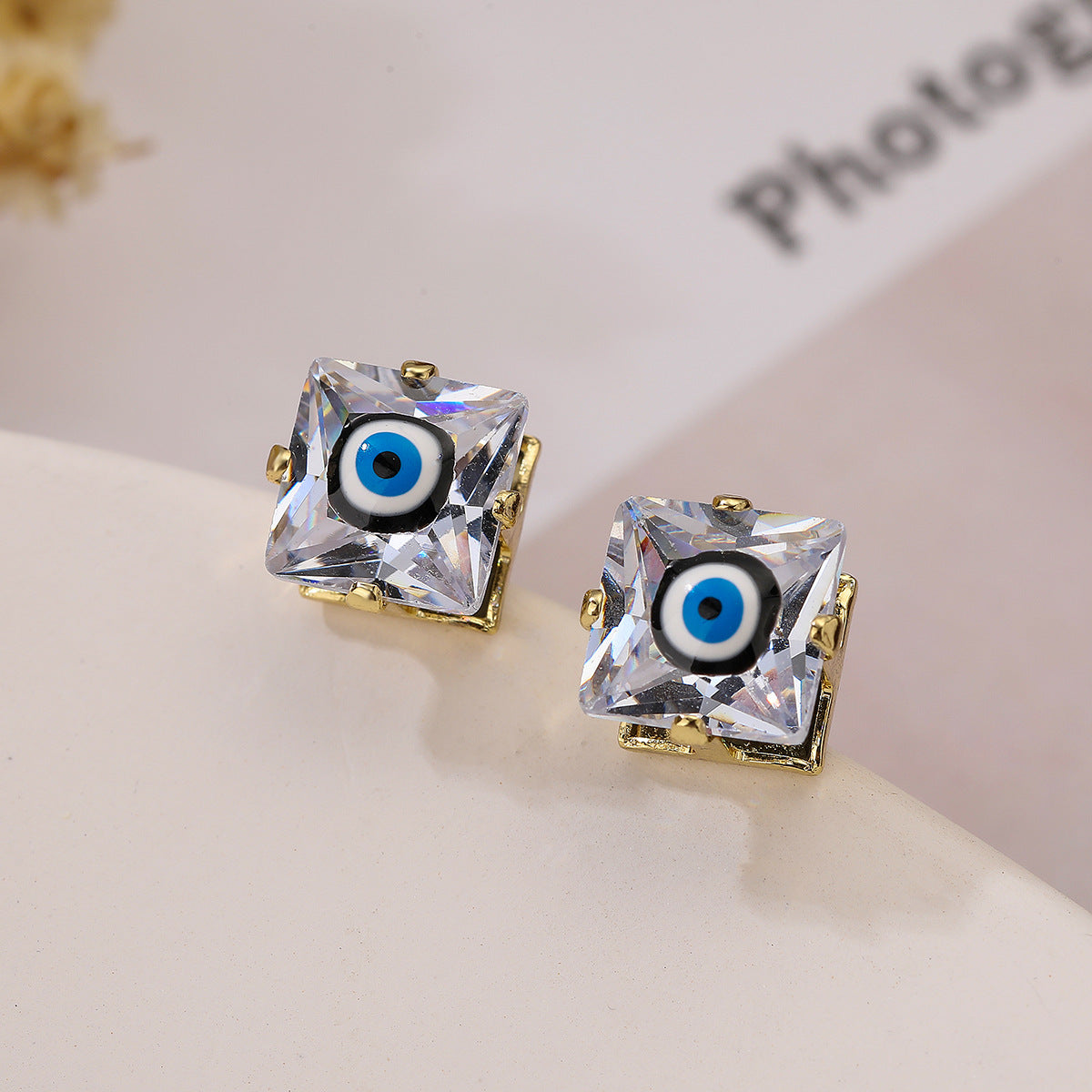 Orecchini a perno geometrici minimalisti con occhio di Horus in rame placcato oro 18K e finitura smaltata