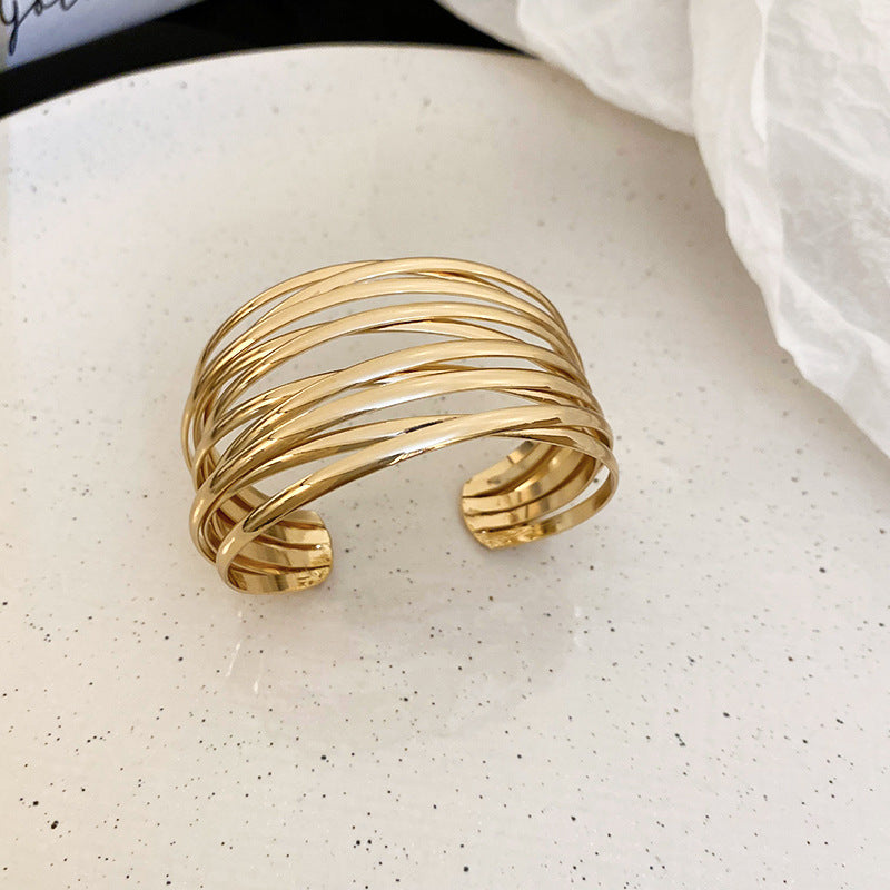 Bracciale rigido aperto geometrico minimalista in lega con finitura placcata per donna