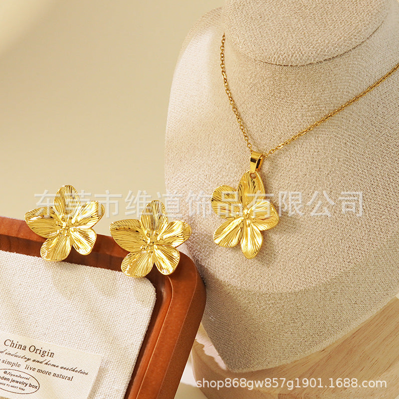 Conjunto de joyas de acero inoxidable con baño de oro minimalista con colgante de corazón floral y lazo en cadena para mujer