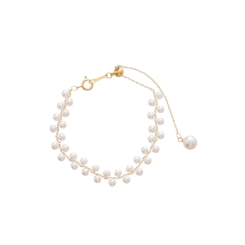 Elegante pulsera trenzada francesa de doble hilera con perlas de imitación para mujer, con detalles geométricos y acabado artesanal