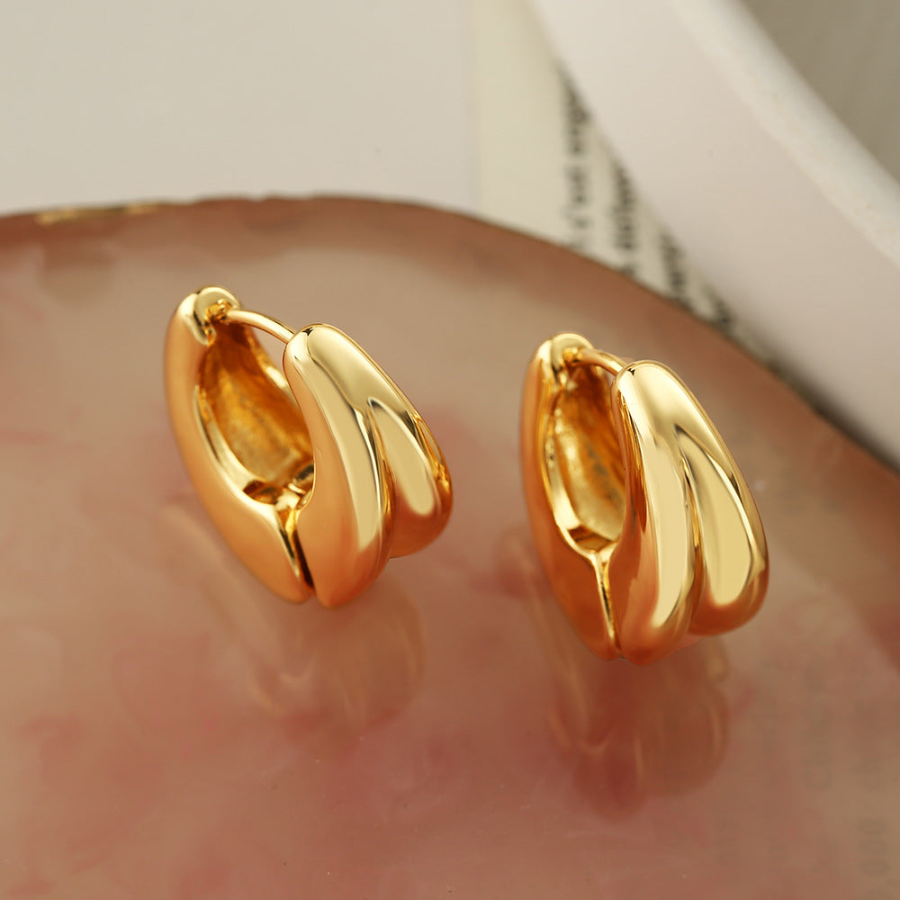 Orecchini a cerchio da donna in rame con placcatura in oro, design geometrico irregolare e minimalista