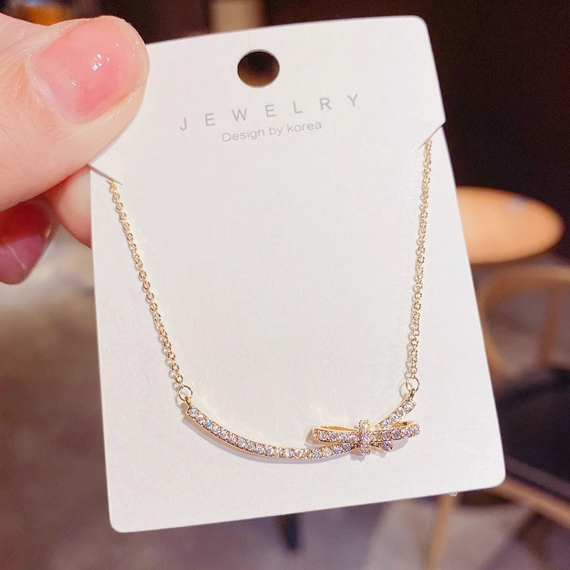 Minimalist Bow-Shaped Titanium Steel Necklace for Women with Alloy Pendant and Cross Chain Design