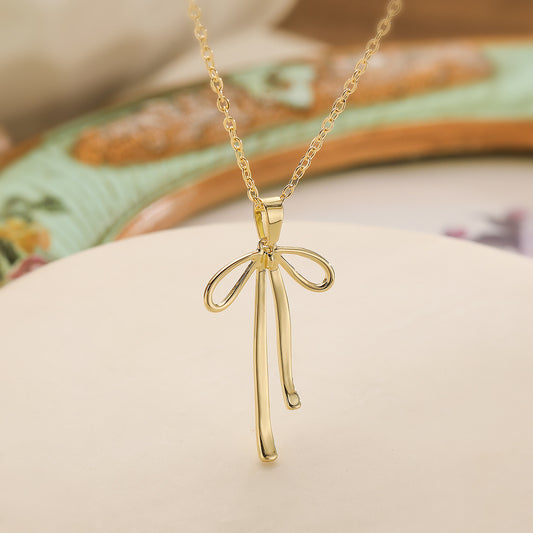 Collana da donna minimalista a forma di fiocco con base in rame e placcatura in oro vero