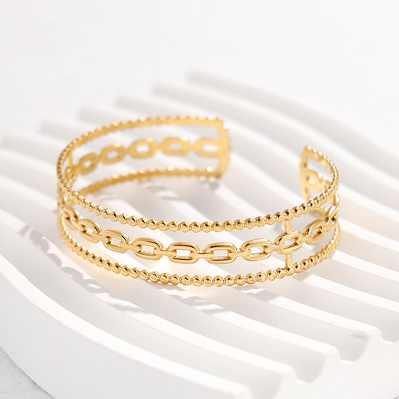 Bracciale da donna in acciaio al titanio con design geometrico minimalista, a forma di C, finitura placcata e dettaglio catena