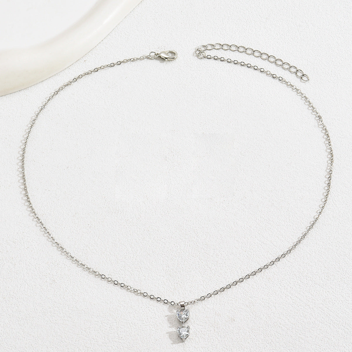 Set di collana e orecchini a cuore minimalista in lega con intarsio di zirconi da donna