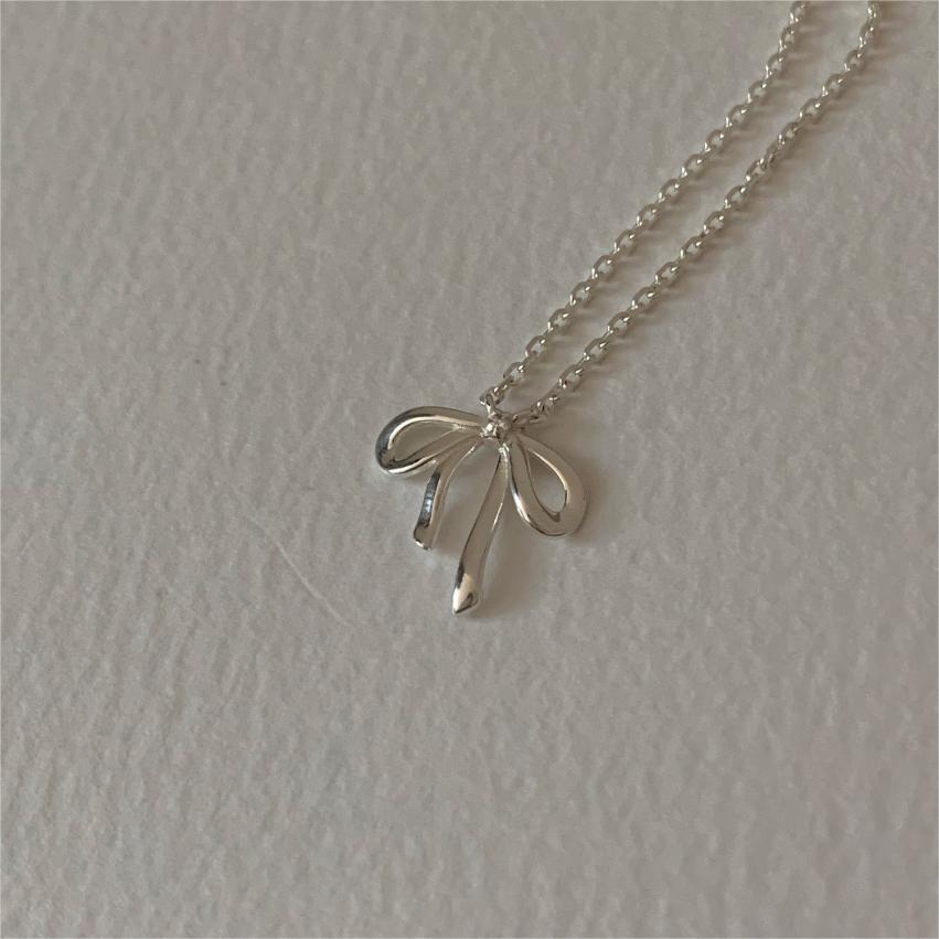 Minimalist Bow Knot Pendant Necklace in 925 Sterling Silver with Plated Finish on Cross Chain