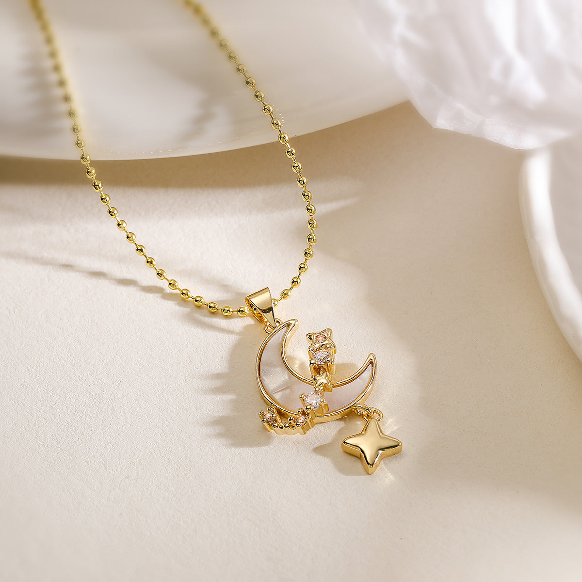 Minimalist Star and Moon Pendant Necklace for Women with Copper Base Plated in 18K Gold Featuring Zircon Inlay and Shell Accents