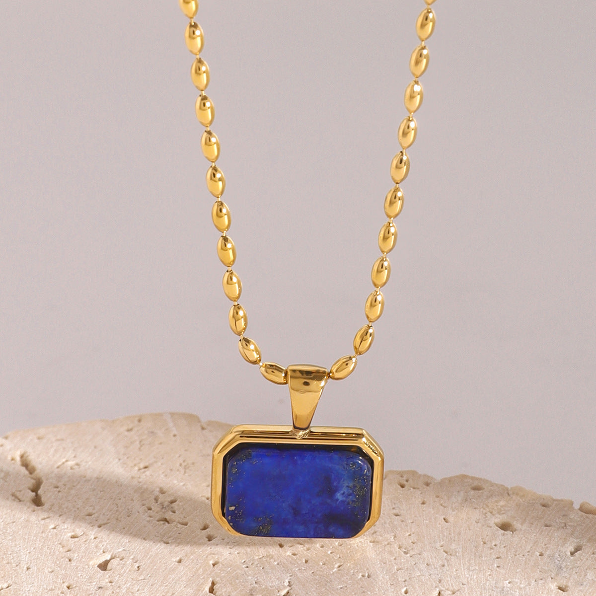 Collana con ciondolo minimalista in occhio di tigre geometrico in acciaio inossidabile con finitura placcata per donna