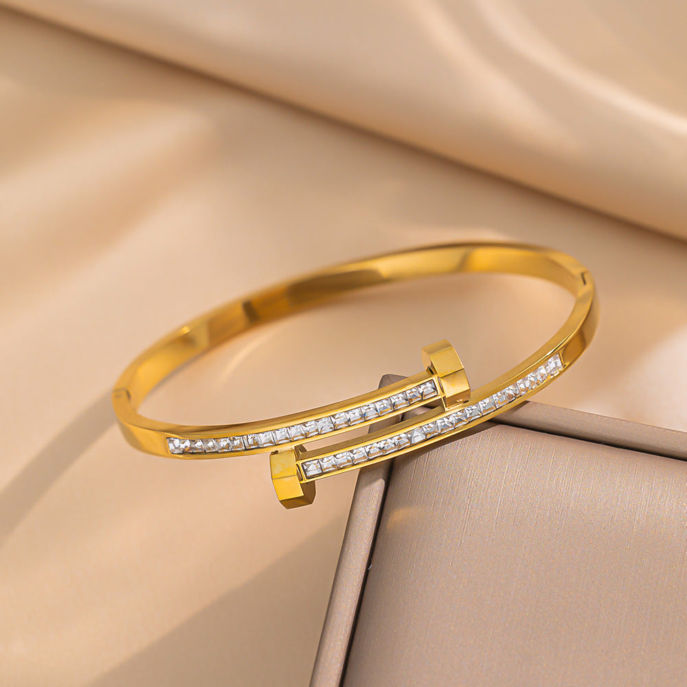 Bracciale minimalista geometrico in acciaio al titanio con zirconi micro-pavé da donna