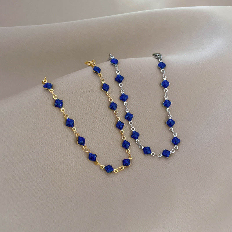 Minimalist Lucky Clover Blue Titanium Steel Bracelet for Women with Gold Plating and Wavy Texture