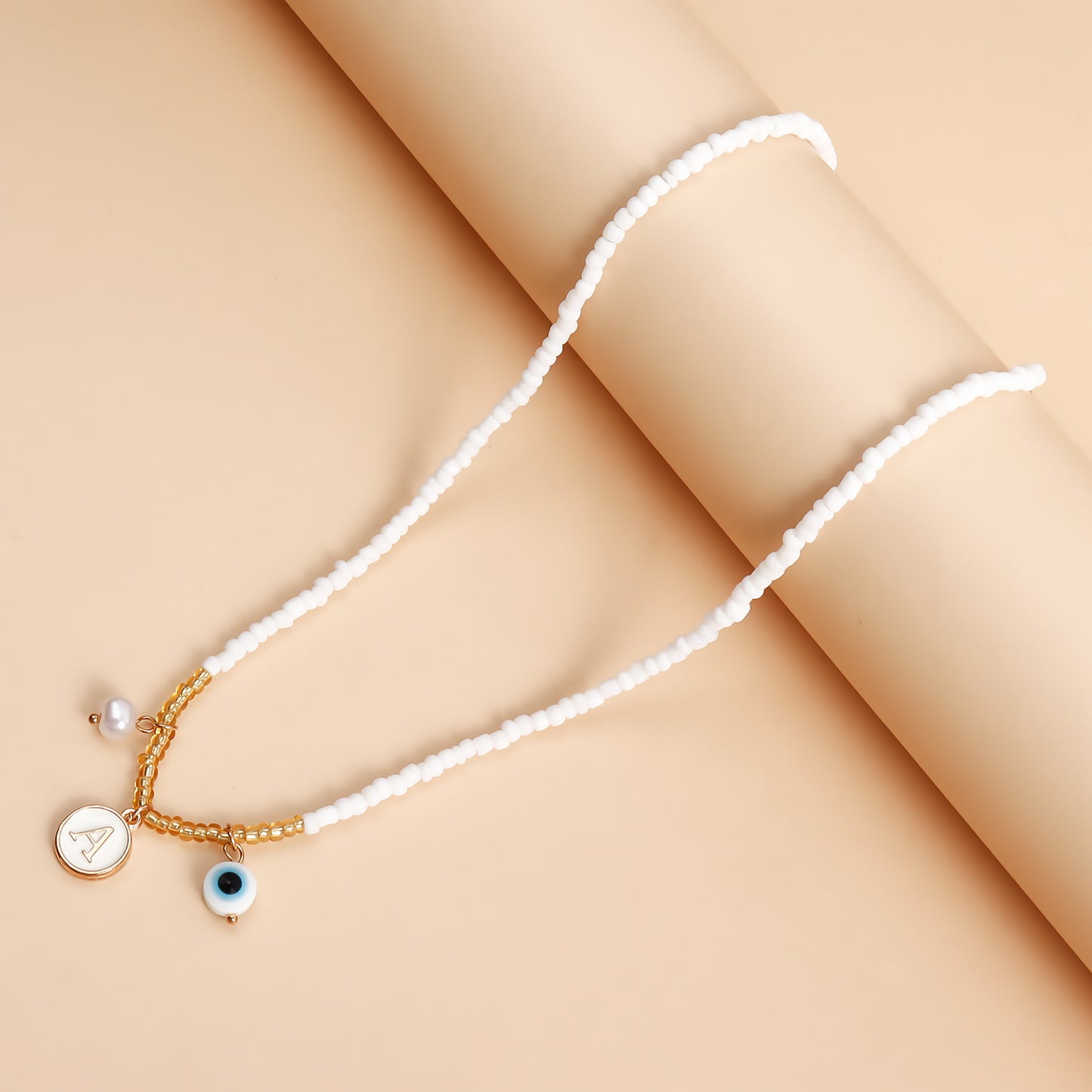 Bohemian White Beaded Necklace with Alloy Letter Eye Pendant on Clavicle Chain
