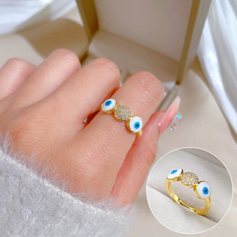 Anello da donna in ottone placcato oro con zirconi micro-incastonati a forma di occhio minimalista