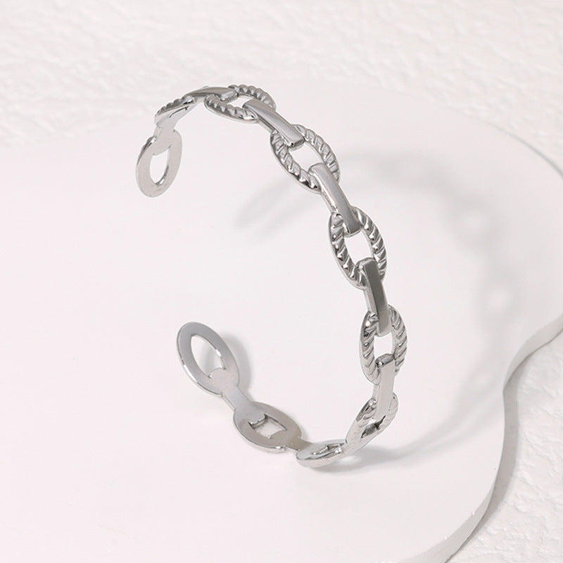 Brazalete geométrico de acero inoxidable con acabado de acero de titanio, galvanizado para una elegancia que no se desvanece, accesorio diario moderno y sofisticado