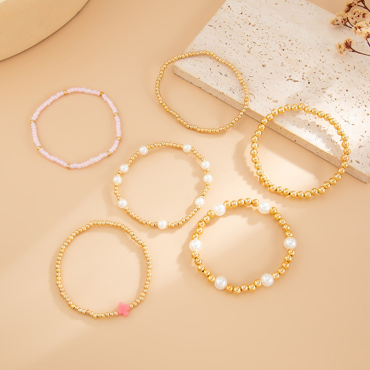 Bracciale da donna elastico in perline Bohemien con stella e croce, impreziosito da perle sintetiche e design irregolare