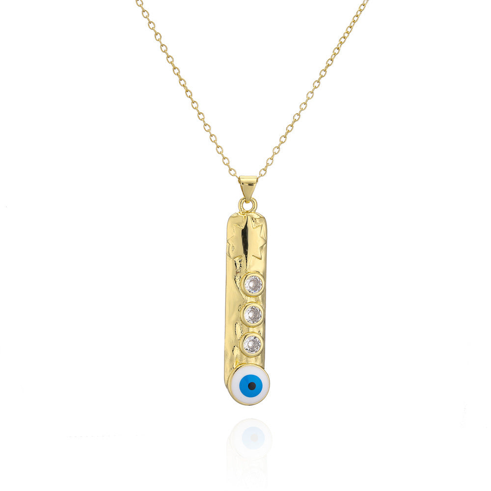 Collana con ciondolo a barra verticale geometrica con base in rame e placcatura in vero oro, design smaltato a occhio turco
